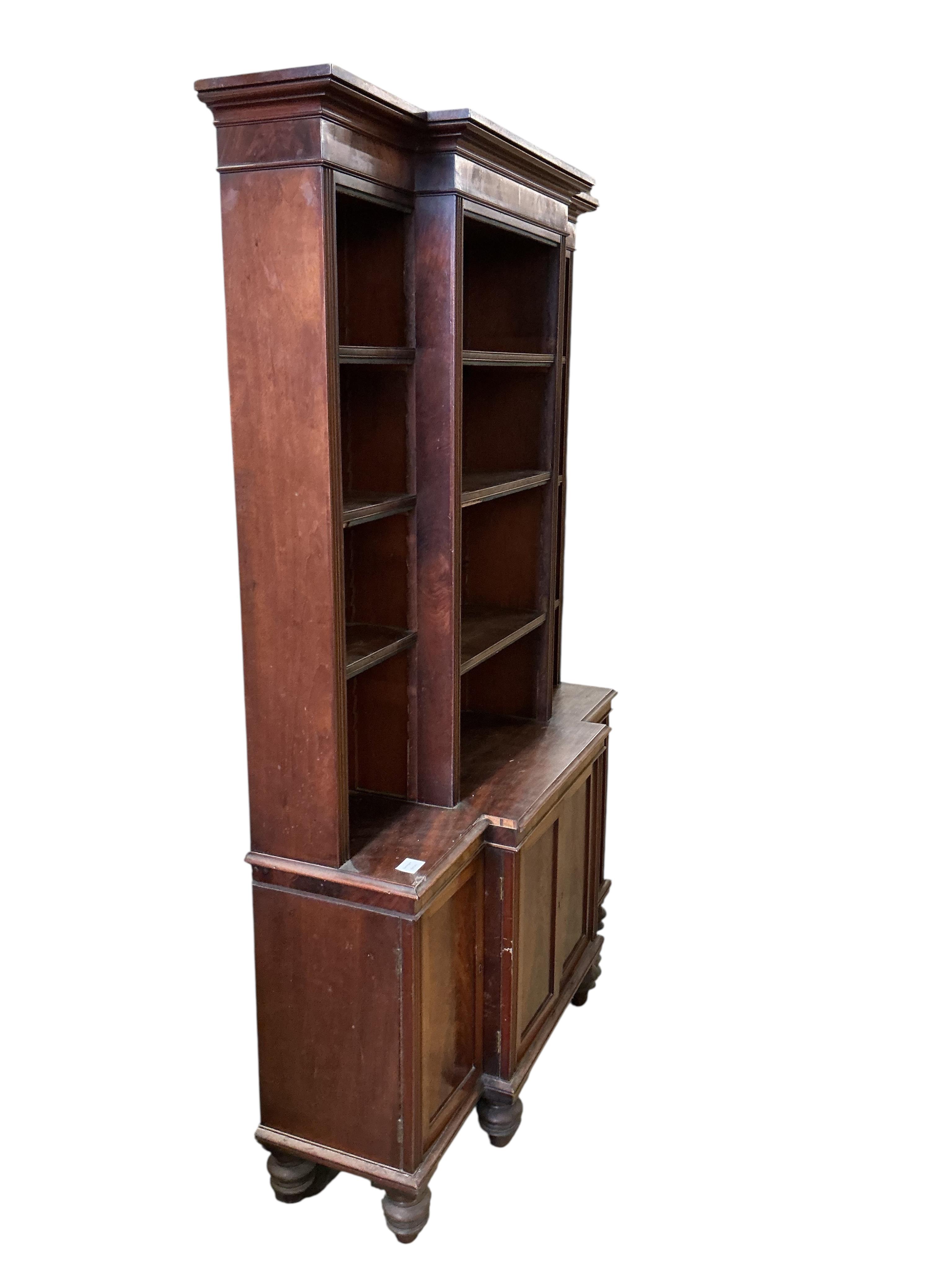 A small George IV style mahogany breakfront bookcase / cupboard, width 110cm, depth 30cm, height 172cm